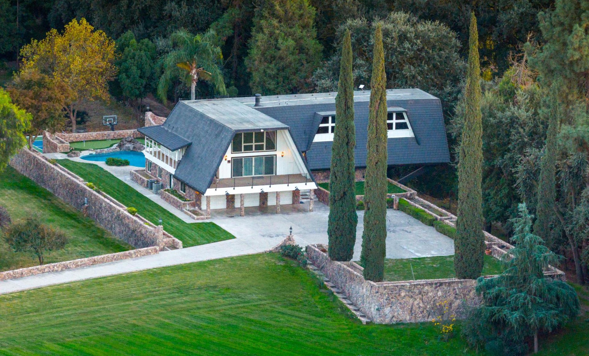 Aerial view of estate with pool and grounds