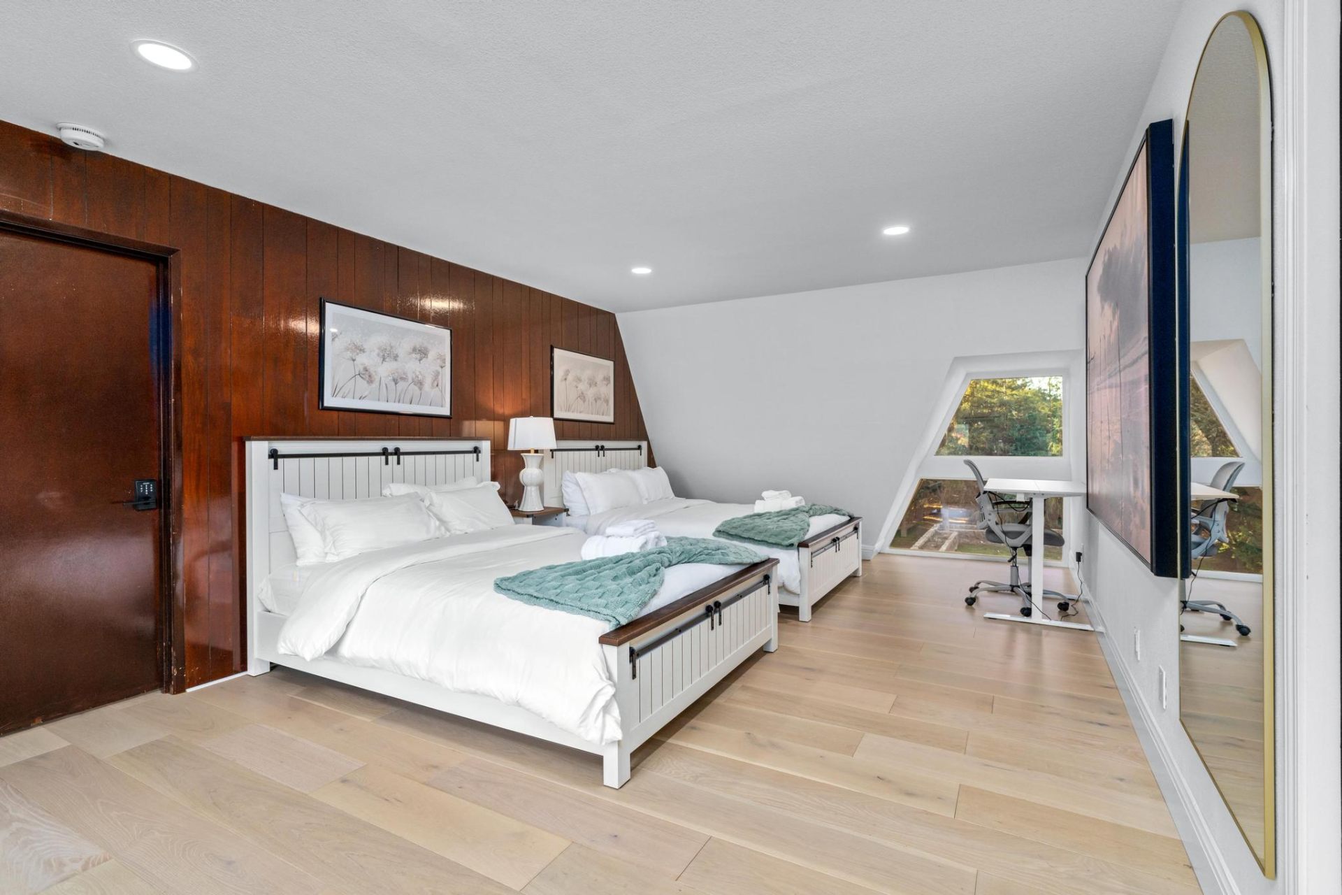 A-frame upstairs suite with twin beds and workspace
