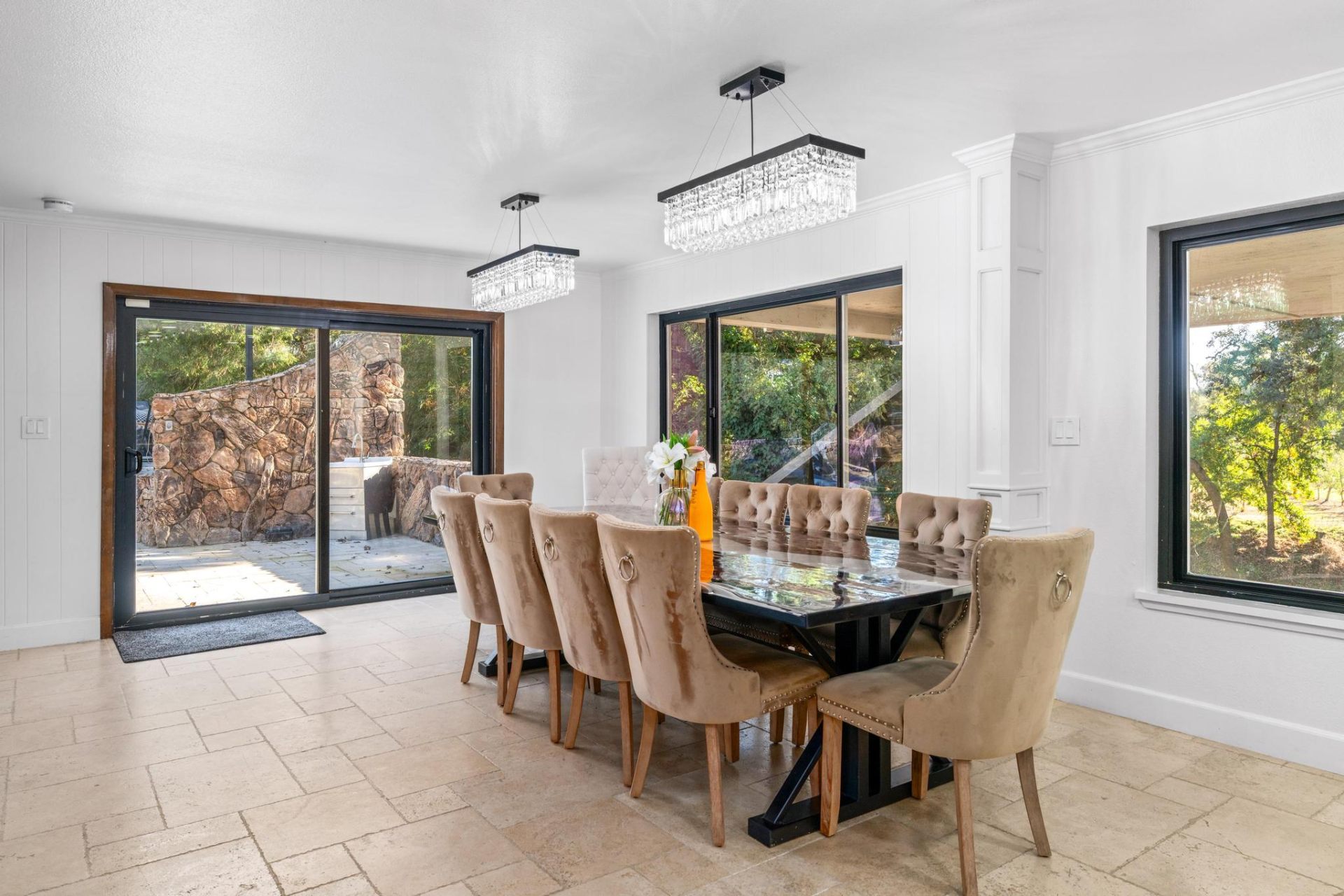 Formal dining room with crystal chandeliers
