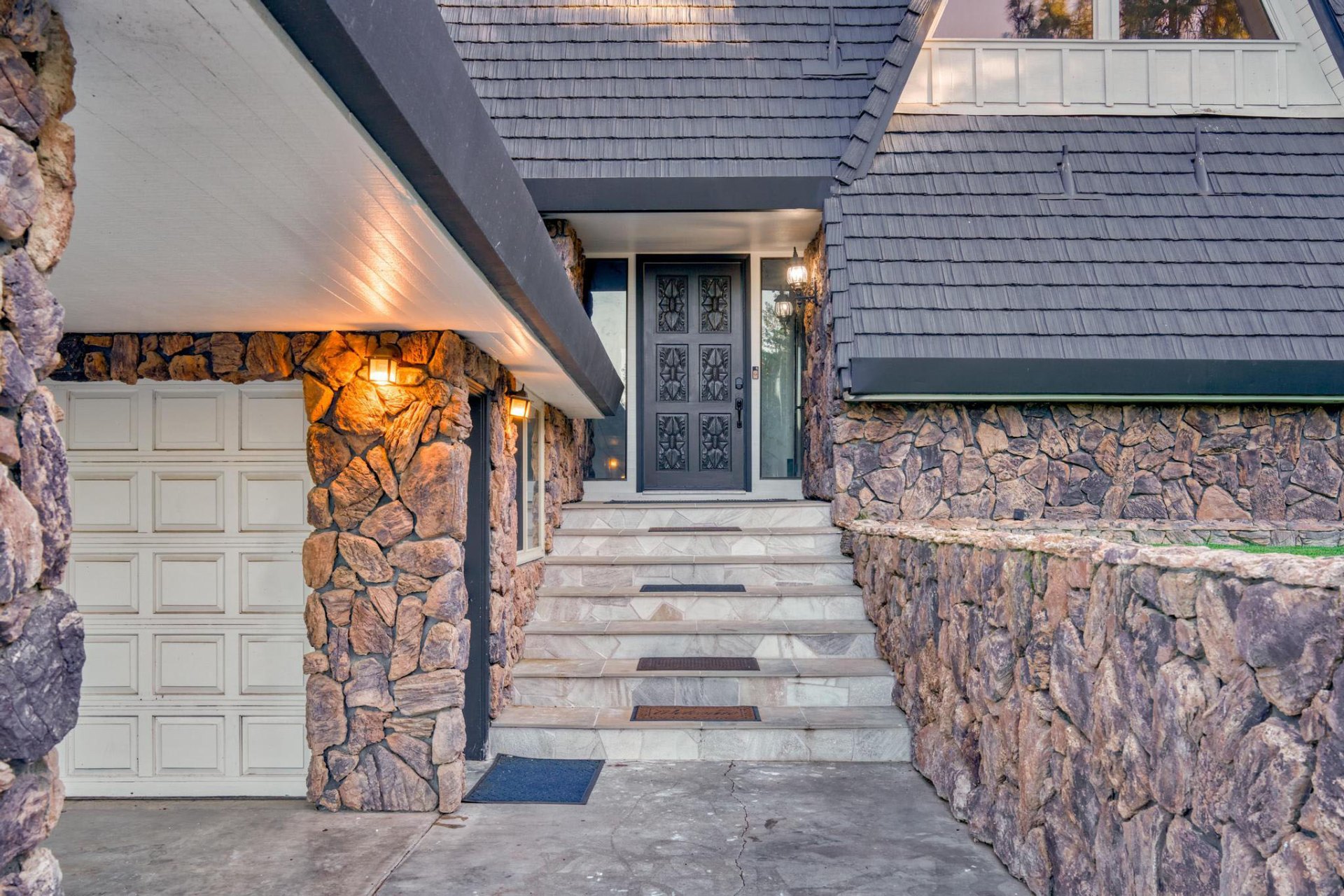 Front entrance with carved door