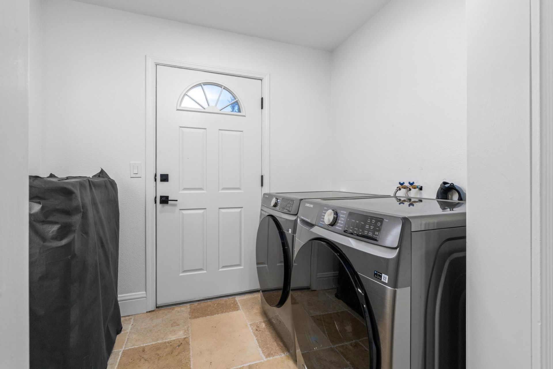 Second laundry room with front-load washer and dryer