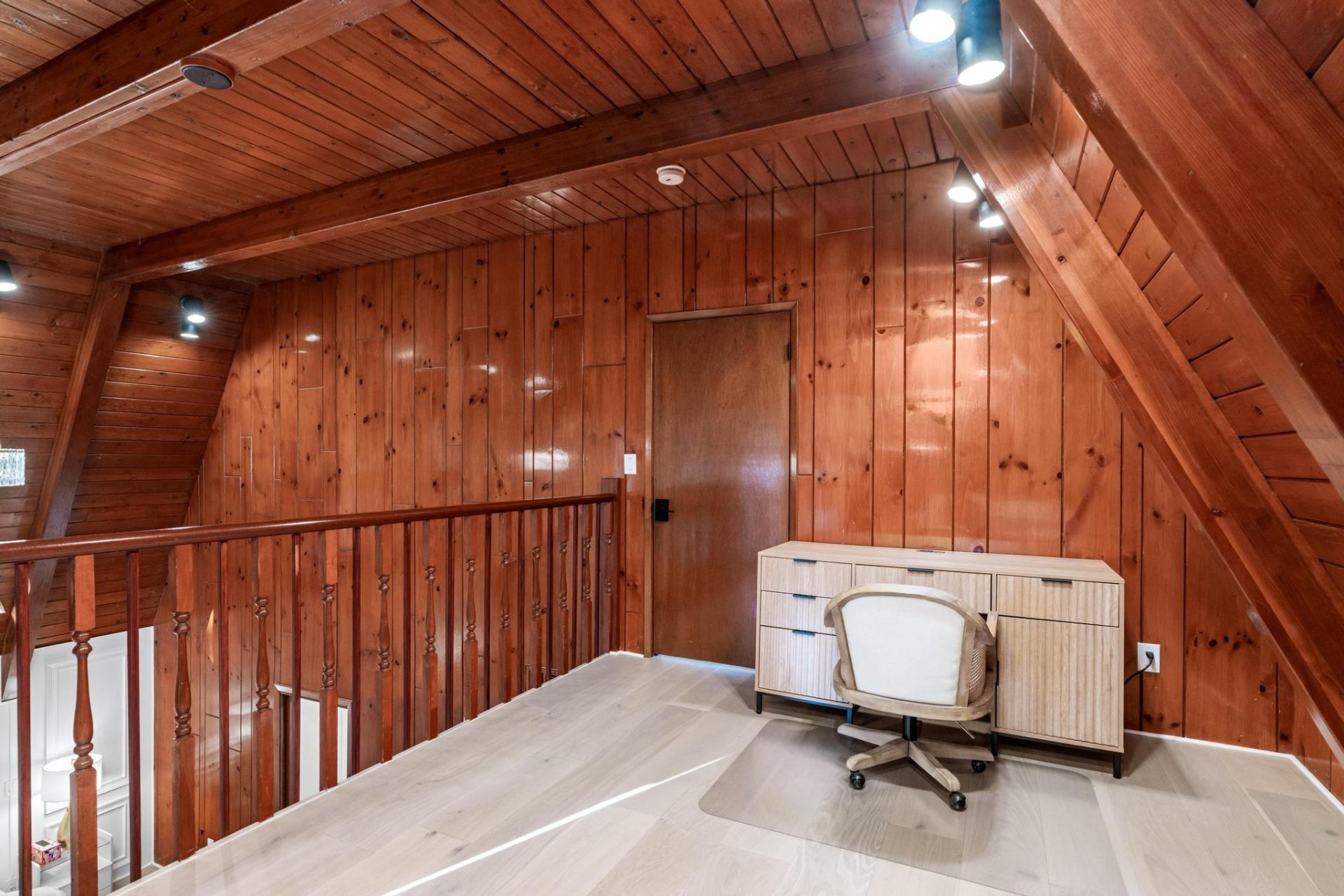 Loft workspace beneath cathedral cedar beams
