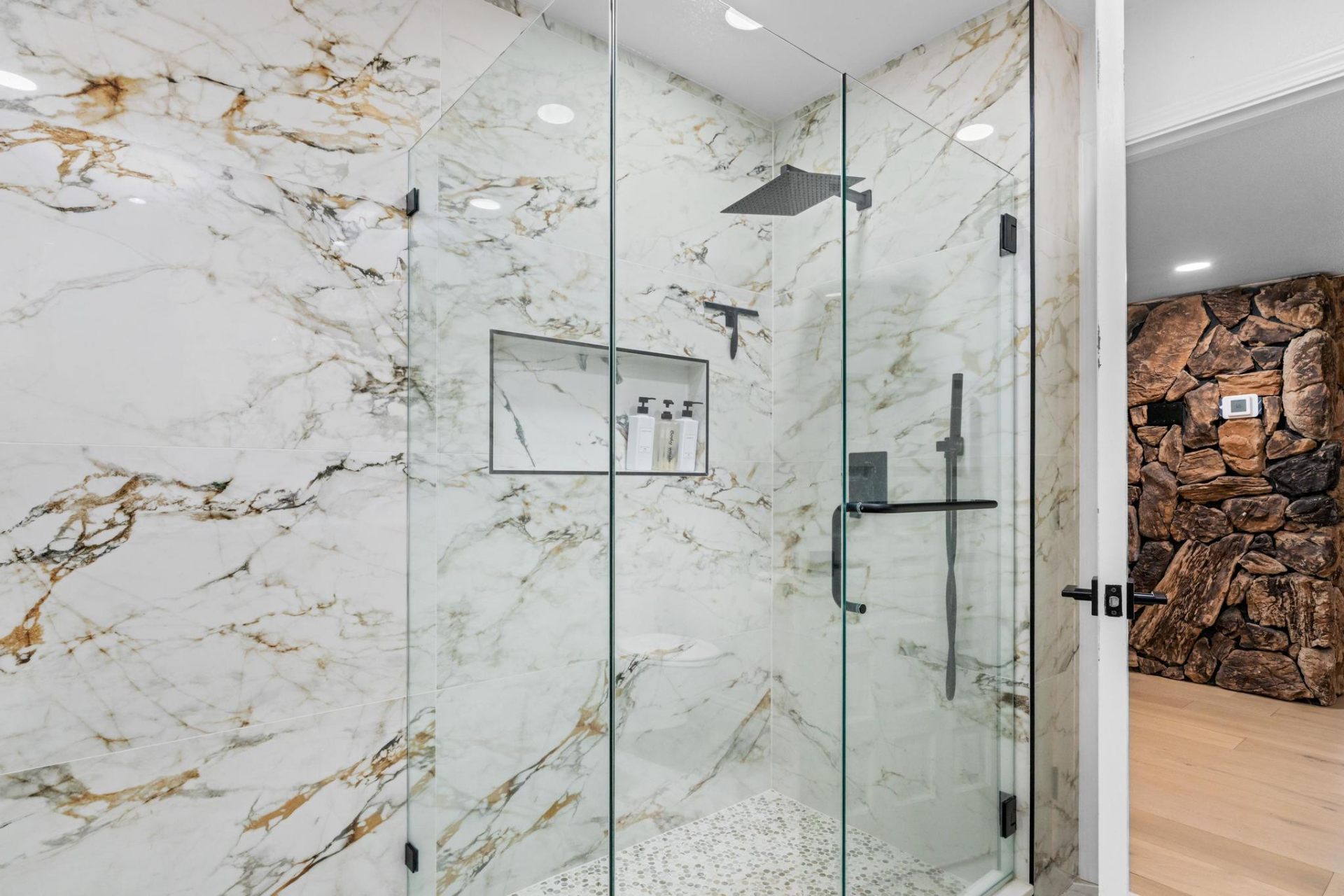 Calacatta gold marble walk-in shower