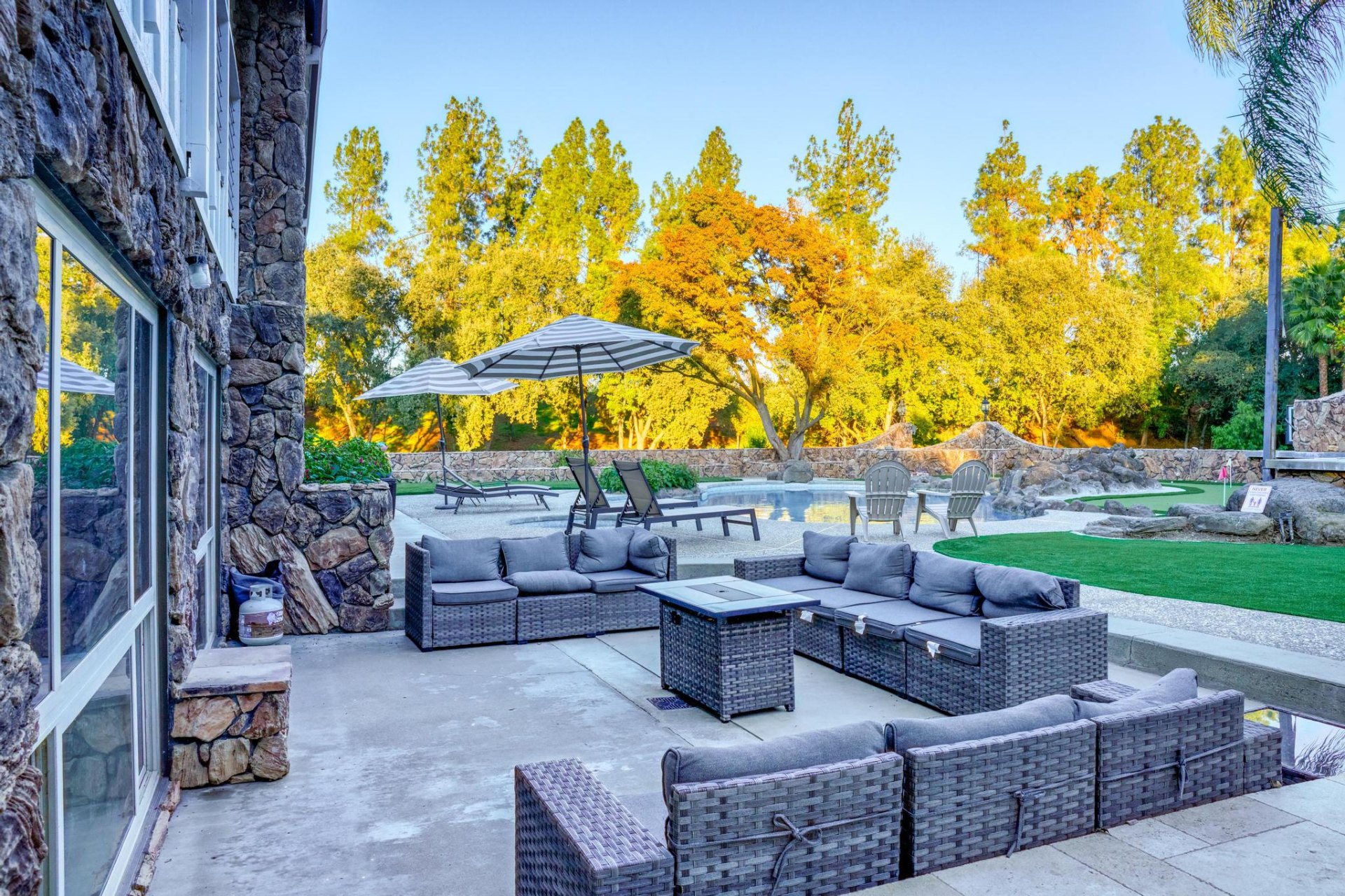 Outdoor sectional lounge with fire table