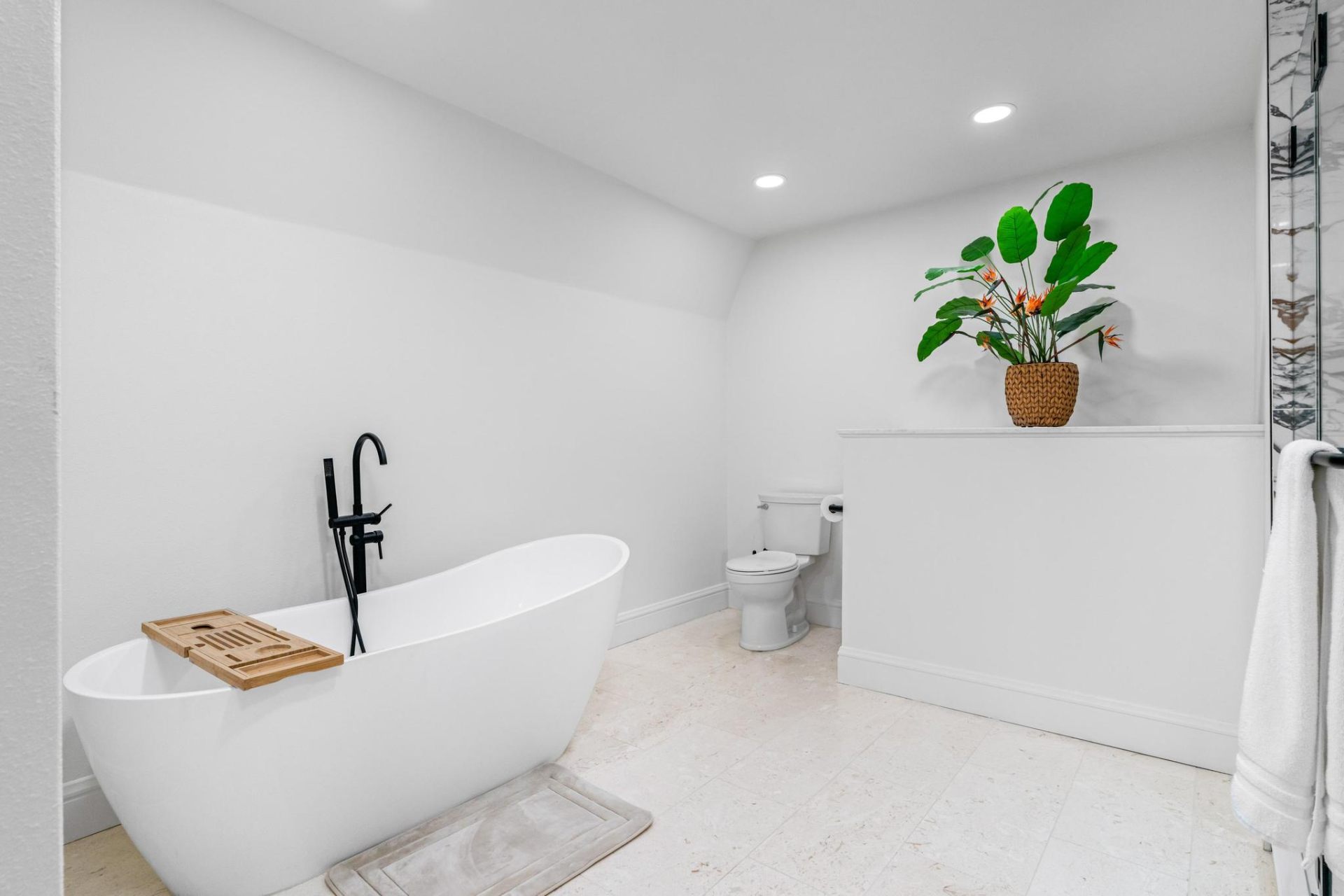 Freestanding soaking tub in spa bathroom
