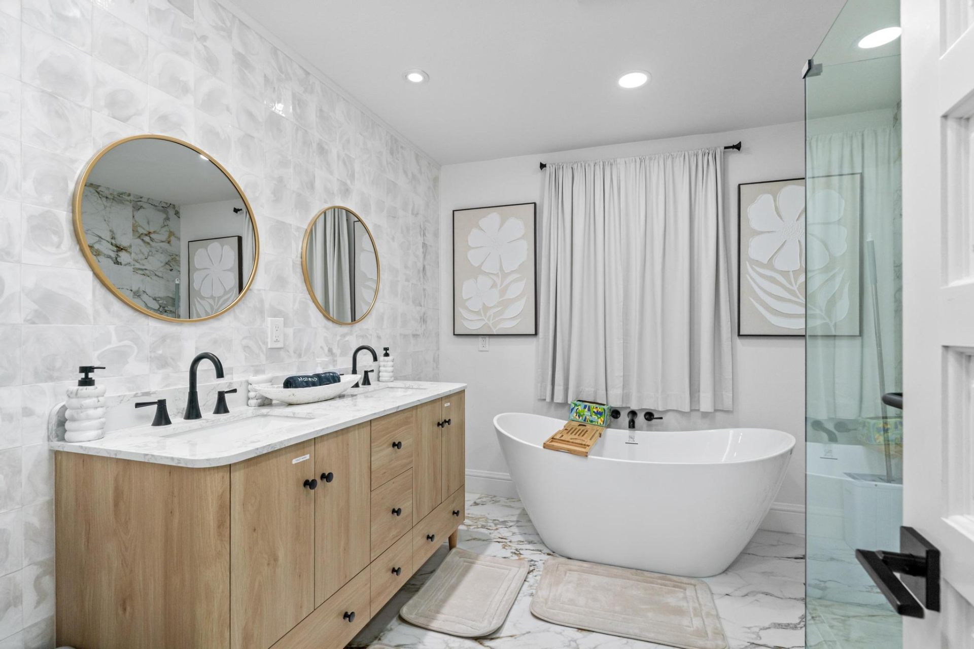 Spa bathroom with freestanding soaking tub and double vanity