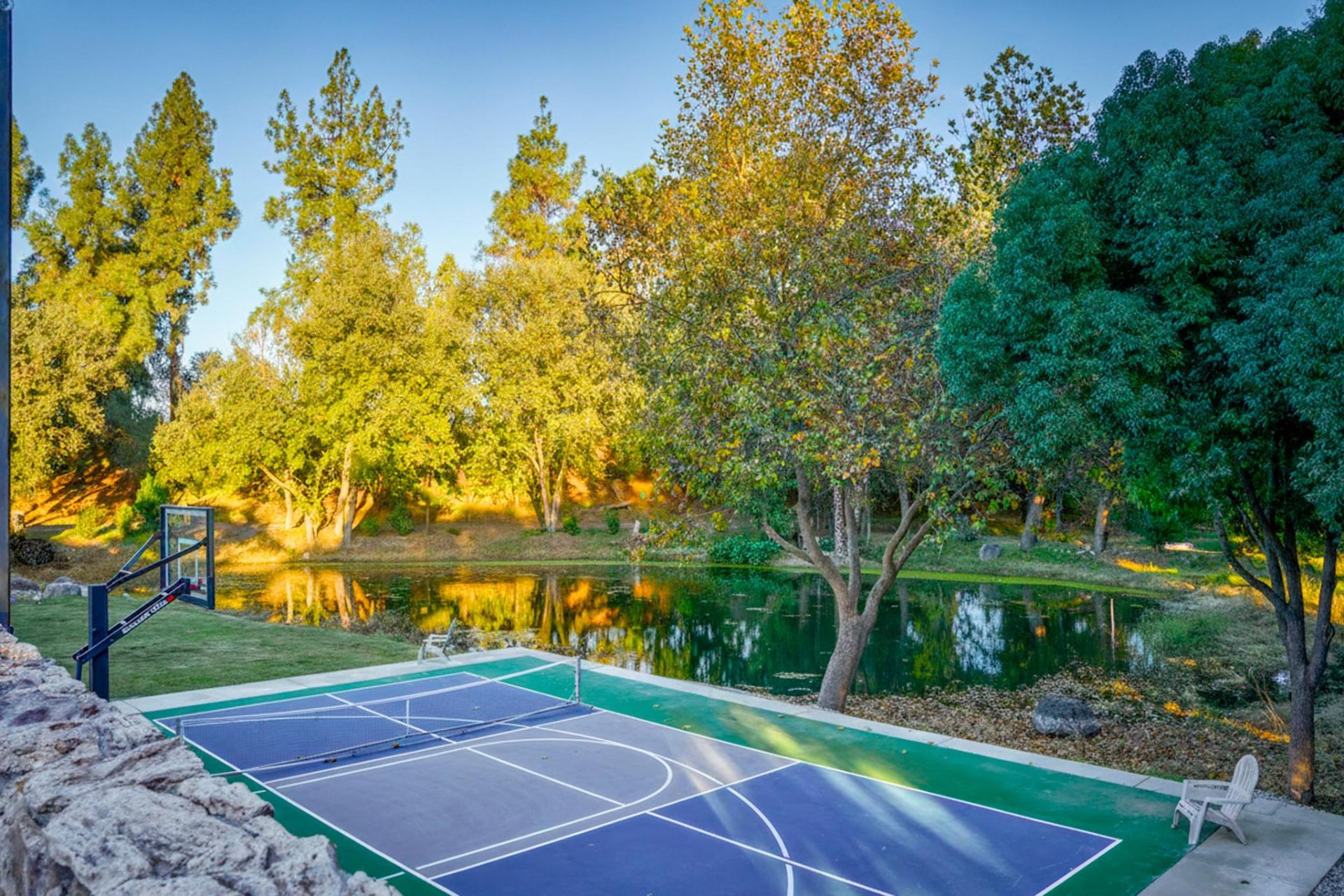 Pickleball and basketball court overlooking the pond