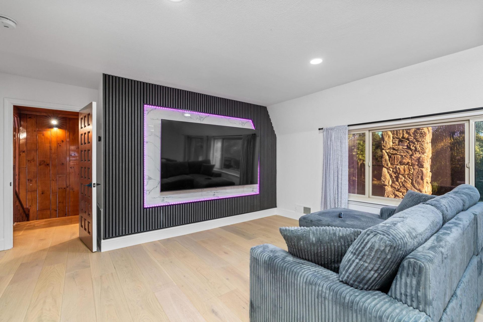 Theater room with large LED-framed display