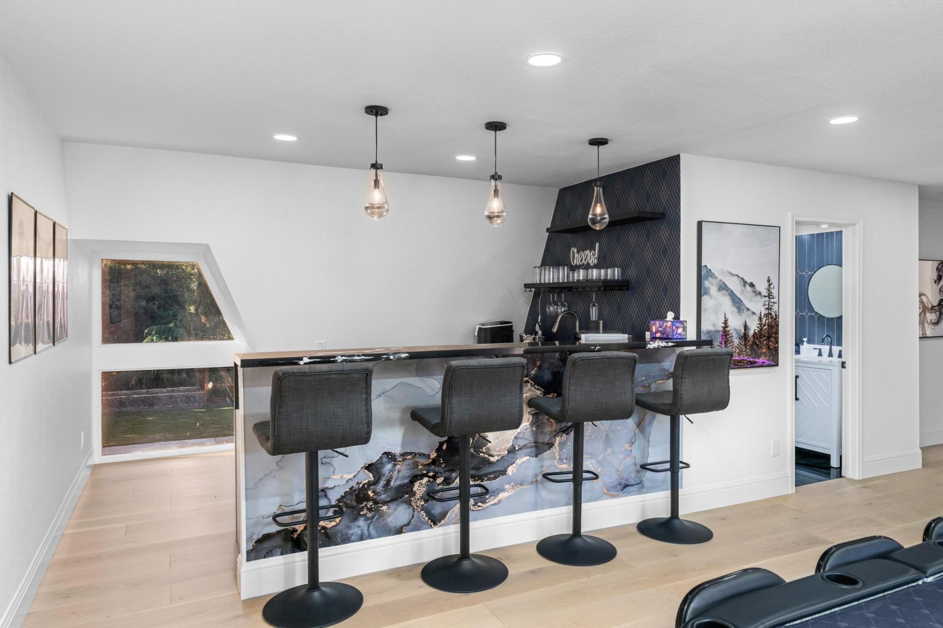 Full wet bar with marble counter and wine fridge